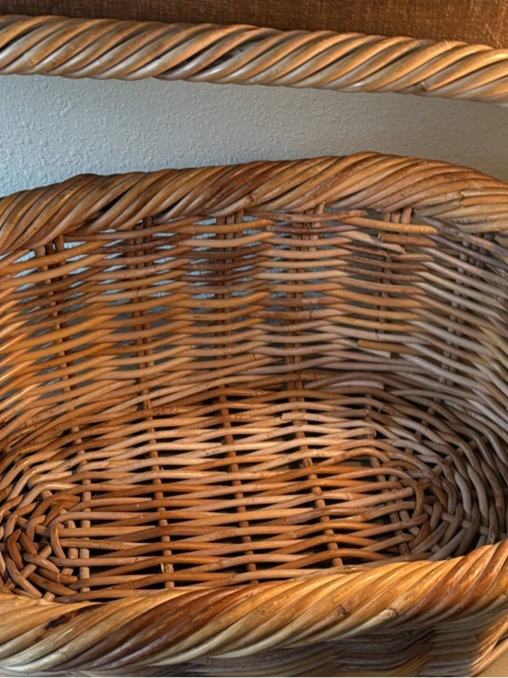 Woven Wicker Basket with Pink Crochet Throw